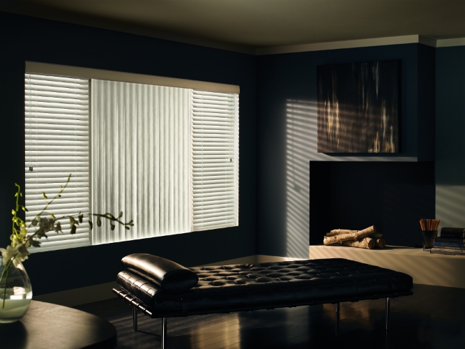 These vertical blinds give the room a soft drapery appeal with the durability of vinyl as well as room darkening features.  ShutterLuxe can help you find the right textured neutral or color to match!